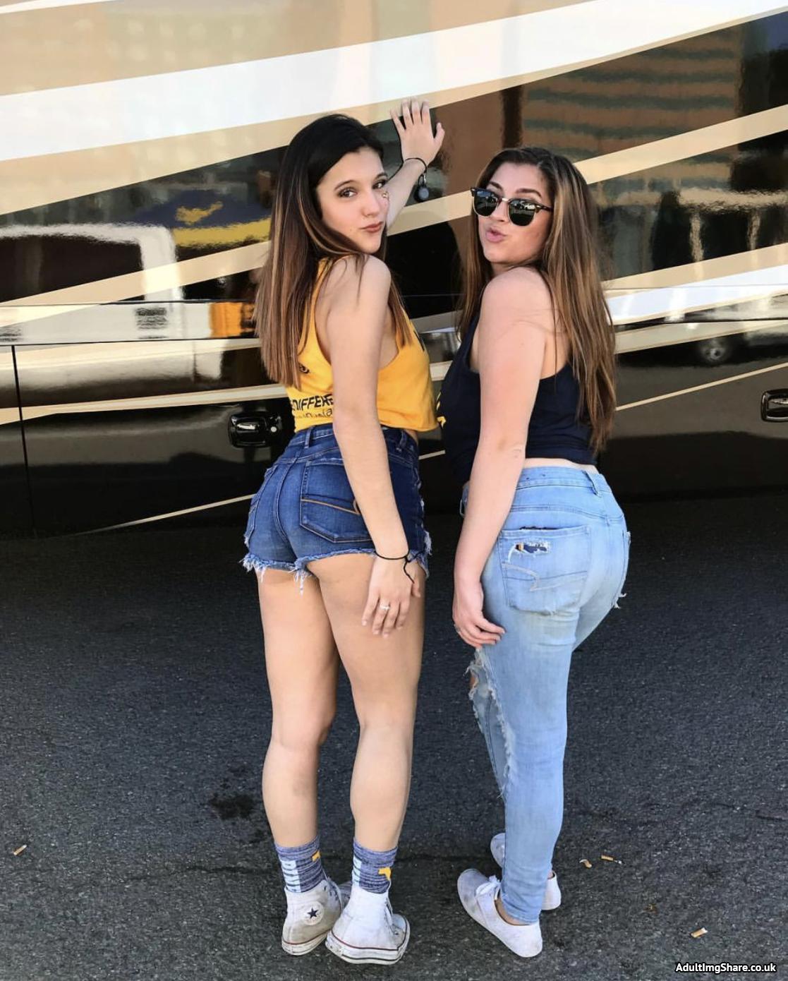 Two cute college girls with nice butts get a photo taken together