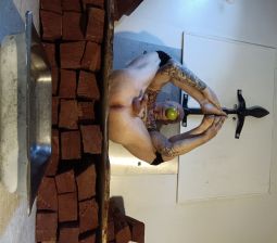 Longpig Poses With Firewood for BBQ.