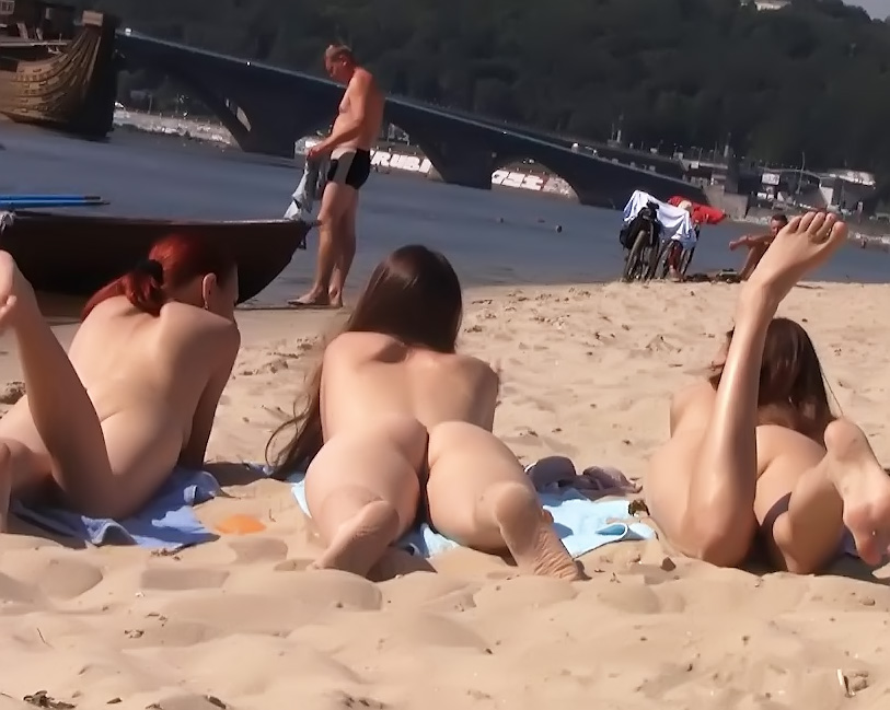 3 nude teens sunbathing at the beach