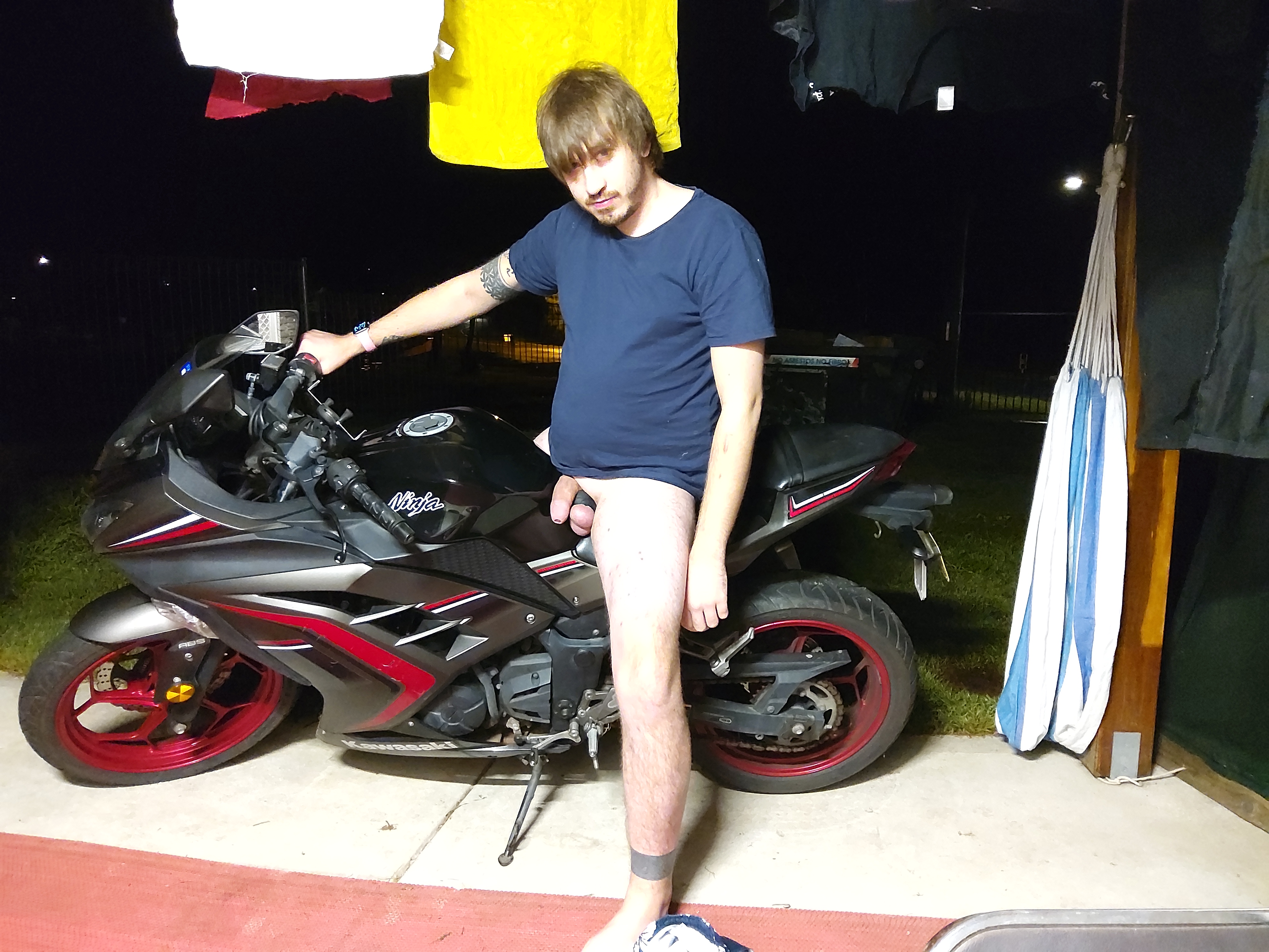 Outside on my motorbike exposing my cock