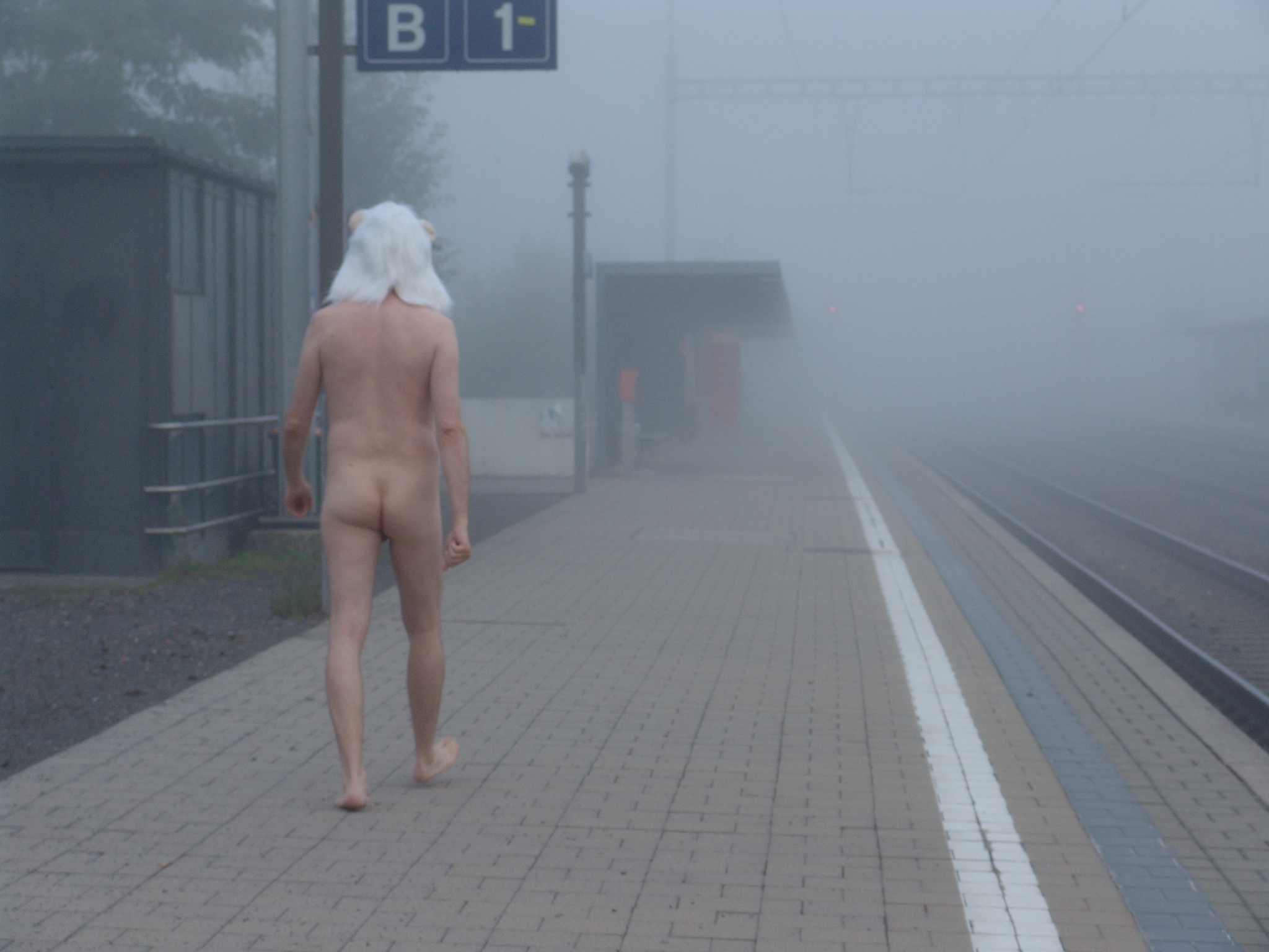 Nude at a railway station