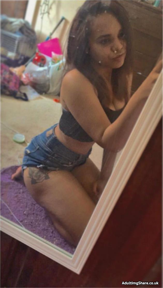 A sexy Girl Takes A mirror selfie showing off her legs. 