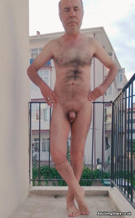 Posing nude on the balcony